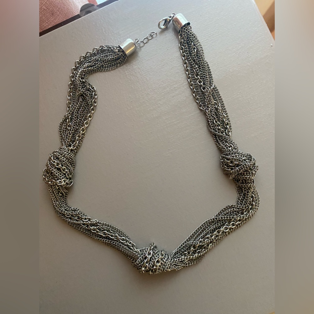 Silver necklace.